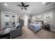 Comfortable bedroom featuring a ceiling fan, balcony and ample storage at 44 Martinique Ave, Tampa, FL 33606