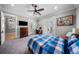 Spacious bedroom with ceiling fan, closet and french doors leading to an outdoor balcony at 44 Martinique Ave, Tampa, FL 33606