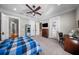 Spacious bedroom featuring multiple closets, work area, and french door access to an outdoor balcony at 44 Martinique Ave, Tampa, FL 33606