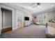 A bright and spacious bedroom has double doors with views of the backyard at 44 Martinique Ave, Tampa, FL 33606