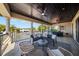 This covered patio has stylish furniture and ceiling fans, perfect for outdoor relaxation and entertaining at 44 Martinique Ave, Tampa, FL 33606