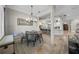 Dining area with modern chandelier, view of the kitchen, and elegant architectural details at 44 Martinique Ave, Tampa, FL 33606