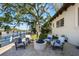 Outdoor seating area with a fire pit, perfect for entertaining with water views at 44 Martinique Ave, Tampa, FL 33606