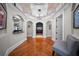 A gorgeous foyer features a tray ceiling and hardwood floors, creating a grand entry at 44 Martinique Ave, Tampa, FL 33606