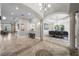 Open-concept foyer with travertine floors, arched doorways, and elegant columns connecting the rooms at 44 Martinique Ave, Tampa, FL 33606