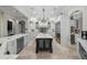 Large open kitchen with a central island, custom cabinetry, and stainless steel appliances at 44 Martinique Ave, Tampa, FL 33606