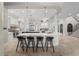 Elegant kitchen featuring a large island with marble countertops, pendant lighting, and stainless steel appliances at 44 Martinique Ave, Tampa, FL 33606