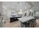 Elegant kitchen featuring a large island with marble countertops, pendant lighting, and stainless steel appliances at 44 Martinique Ave, Tampa, FL 33606