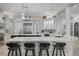 Elegant kitchen featuring a large island with marble countertops, pendant lighting, and stainless steel appliances at 44 Martinique Ave, Tampa, FL 33606