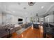 Spacious living room features hardwood floors, fireplace, and bar at 44 Martinique Ave, Tampa, FL 33606