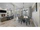 Open-concept living area with a dining area, fireplace, and modern decor at 44 Martinique Ave, Tampa, FL 33606