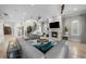 Elegant living room with a fireplace, staircase, comfortable seating, and ample natural light at 44 Martinique Ave, Tampa, FL 33606