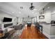 Large living room with hardwood floors, fireplace, and bar area at 44 Martinique Ave, Tampa, FL 33606