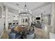 Open-concept living space with dining area, kitchen, fireplace, and staircase at 44 Martinique Ave, Tampa, FL 33606