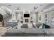 Spacious living room with a fireplace, staircase and comfortable seating arrangement at 44 Martinique Ave, Tampa, FL 33606