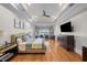 Spacious main bedroom showcasing trey ceilings, ceiling fan, and wood floors at 44 Martinique Ave, Tampa, FL 33606