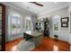 Bright office space featuring a built-in bookcase, hardwood floors, natural light, and neutral decor at 44 Martinique Ave, Tampa, FL 33606