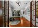 Stylish home office with hardwood floors, custom built-ins, large windows, and a sophisticated color palette at 44 Martinique Ave, Tampa, FL 33606