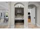Convenient office nook with a built-in desk, cabinets, and tile backsplash at 44 Martinique Ave, Tampa, FL 33606