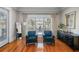 Sitting room with hardwood floors, plantation shutters, and water views at 44 Martinique Ave, Tampa, FL 33606