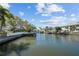 Scenic waterfront view showcasing the canal and surrounding homes at 44 Martinique Ave, Tampa, FL 33606