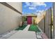 View of back yard with storage shed featuring painted red door with a walkway to the yard at 440 Woods Landing Trl, Oldsmar, FL 34677