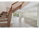 Spacious living room featuring modern flooring and a sliding glass door to the outdoors at 440 Woods Landing Trl, Oldsmar, FL 34677