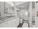 Bathroom featuring a white vanity, updated fixtures, and a glass-enclosed shower at 4460 Fairways Blvd # 401, Bradenton, FL 34209