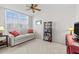 Bright bedroom with a sofa, bookshelf, and a large window at 4460 Fairways Blvd # 401, Bradenton, FL 34209