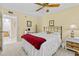 Bedroom with ceiling fan, bedside tables, soft carpet and a doorway leading to other rooms at 4460 Fairways Blvd # 401, Bradenton, FL 34209