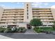 Exterior of a multi-story building with balconies and well-maintained landscaping at 4460 Fairways Blvd # 401, Bradenton, FL 34209