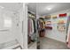 Walk-in closet providing ample storage, along with a shower with glass door at 4460 Fairways Blvd # 401, Bradenton, FL 34209