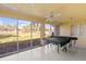 Large recreational room with ping pong table, sliding glass doors to a backyard view, and ceiling fan at 4460 Fairways Blvd # 401, Bradenton, FL 34209