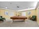 Spacious game room featuring a billiard table, comfortable seating, and plenty of natural light at 4460 Fairways Blvd # 401, Bradenton, FL 34209
