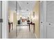 Hallway featuring mirrored closet doors, light walls, and tiled flooring at 4460 Fairways Blvd # 401, Bradenton, FL 34209