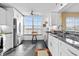 Modern kitchen featuring stainless steel appliances and dark granite countertops at 4460 Fairways Blvd # 401, Bradenton, FL 34209