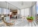 Enclosed lanai features tiled floor, ceiling fan, and sliding glass doors leading to the living room at 4460 Fairways Blvd # 401, Bradenton, FL 34209