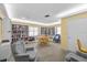 Inviting library room with extensive bookshelves, comfortable seating, and a cozy reading area at 4460 Fairways Blvd # 401, Bradenton, FL 34209