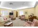 Comfortable living room with cozy furniture, natural light, and classic decor at 4460 Fairways Blvd # 401, Bradenton, FL 34209