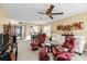 Bright living room featuring comfortable seating, ceiling fan, and elegant decor at 4460 Fairways Blvd # 401, Bradenton, FL 34209