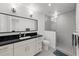 Modern bathroom featuring double sink vanity, large mirror, and tiled glass shower at 4950 Bayshore Blvd # 14, Tampa, FL 33611