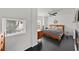 Bright bedroom with wood-look floors, ceiling fan, fireplace and plenty of natural light at 4950 Bayshore Blvd # 14, Tampa, FL 33611