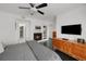 Large main bedroom featuring a fireplace, modern decor, and black wood-look flooring at 4950 Bayshore Blvd # 14, Tampa, FL 33611