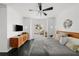 Sun-filled primary bedroom with dark wood floors, a ceiling fan and neutral decor at 4950 Bayshore Blvd # 14, Tampa, FL 33611