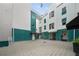 Unique architecture with a teal and white facade plus covered entries and shared courtyard space at 4950 Bayshore Blvd # 14, Tampa, FL 33611