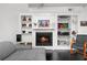 Cozy living room with a fireplace, built-in shelving, and comfortable seating at 4950 Bayshore Blvd # 14, Tampa, FL 33611
