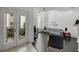 Bright living room featuring modern furnishings, hardwood floors, and a large window overlooking the courtyard at 4950 Bayshore Blvd # 14, Tampa, FL 33611