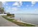 Picturesque waterfront view showcasing lush landscaping and serene waters with a distant cityscape at 4950 Bayshore Blvd # 14, Tampa, FL 33611