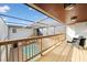 A balcony with a view of the screened-in pool, railing, and outdoor furniture at 5011 S Elberon St, Tampa, FL 33611