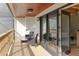 A balcony with a ceiling fan, outdoor furniture, and a view into the house at 5011 S Elberon St, Tampa, FL 33611